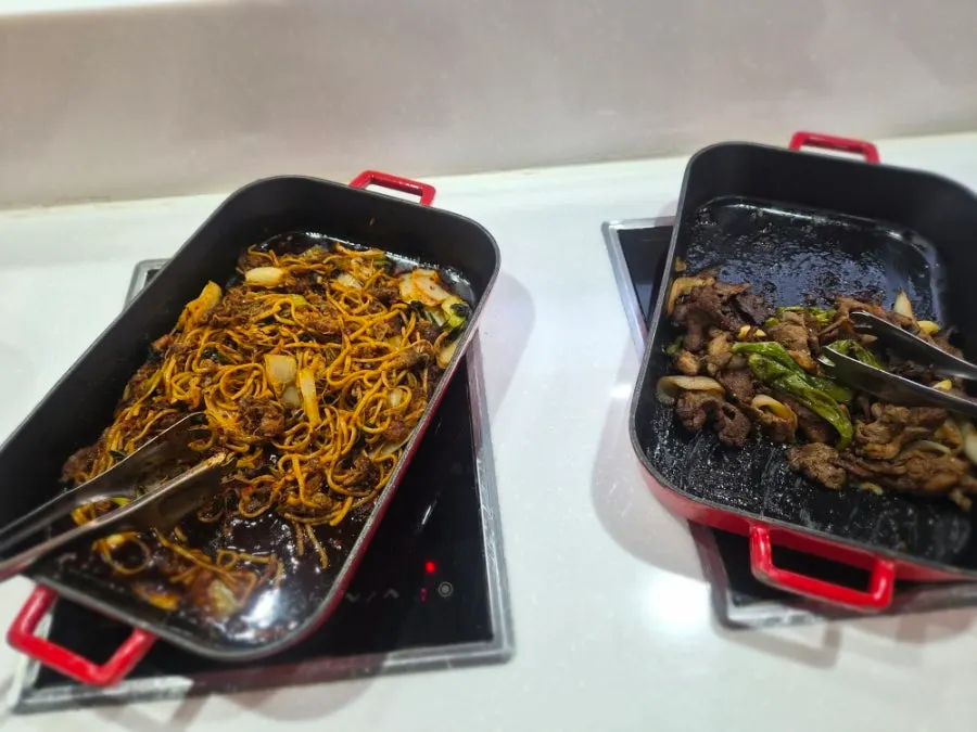 Sweet and sour pork and sushi at the salad bar