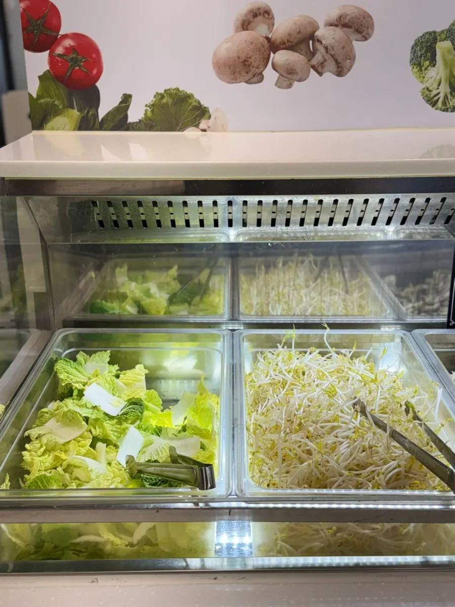 Sign listing Tongkeun Shabu's broth options