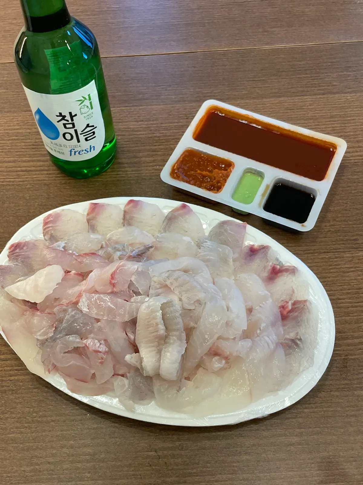 A plate full of sashimi with no filler radish garnish