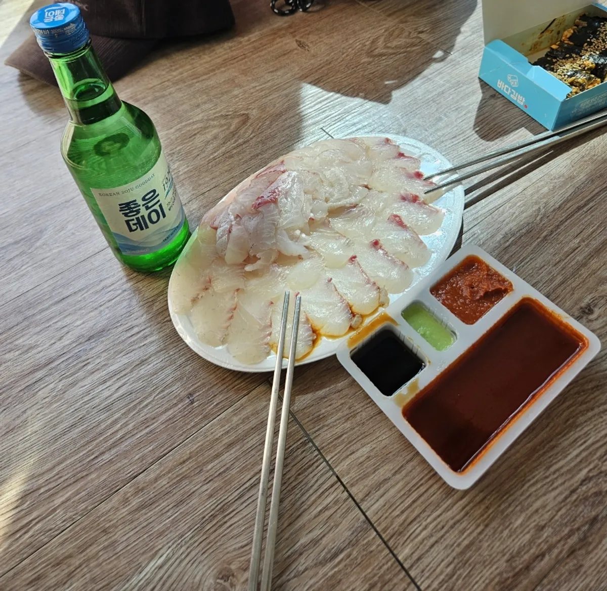 Day drinking spread with red sea bream sashimi and Joeun Day soju