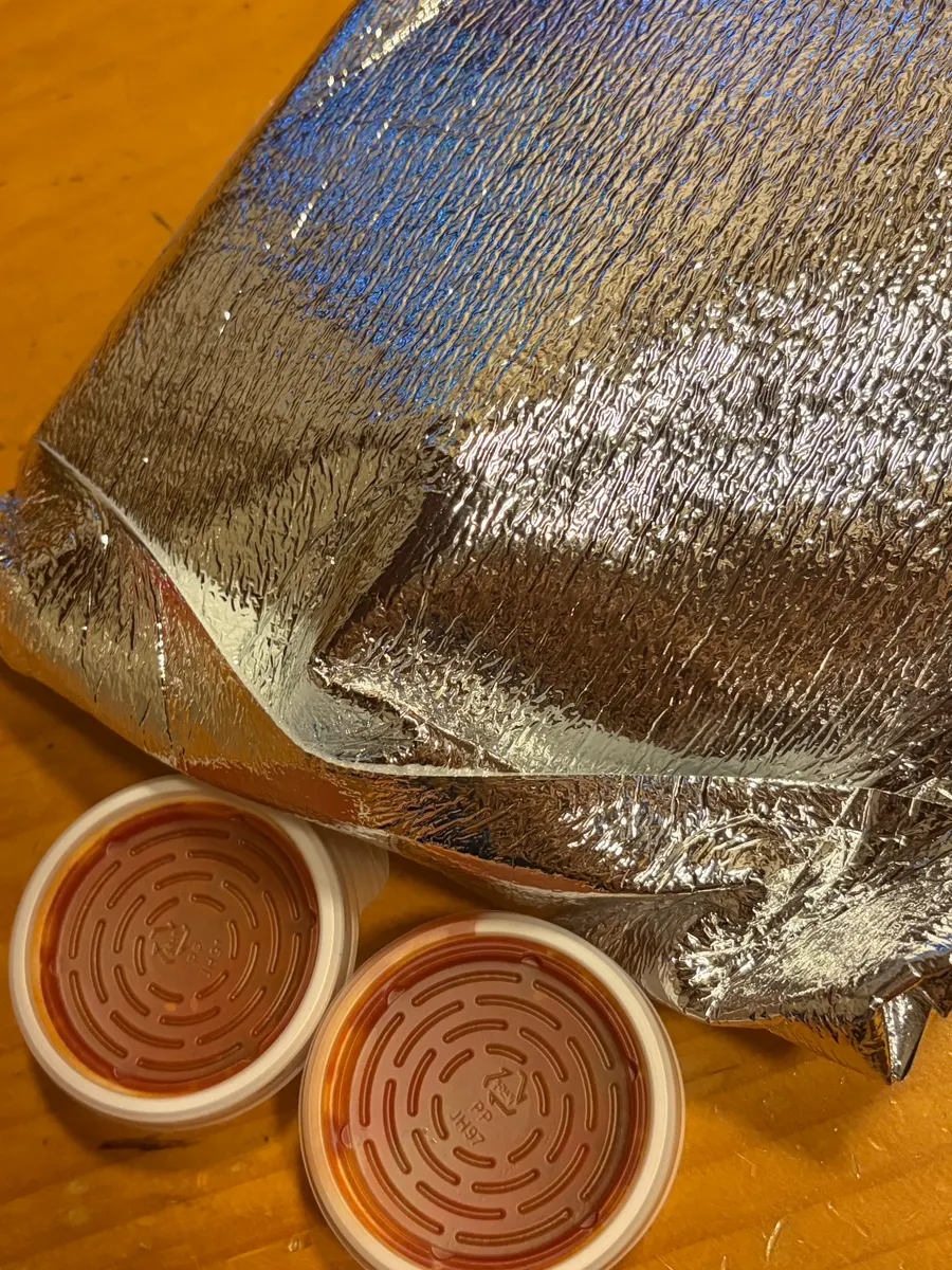 Small size live squid sashimi packed to go