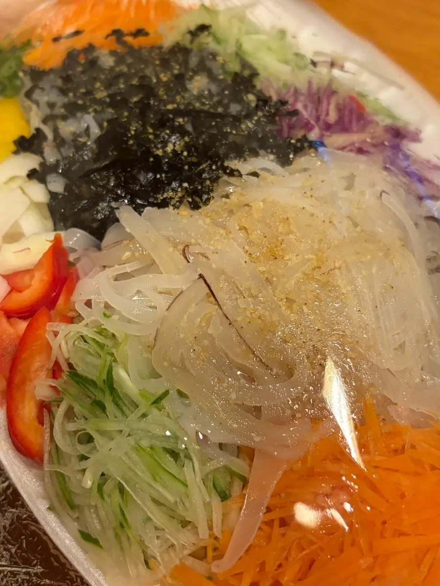 Packed live squid sashimi container ready to go