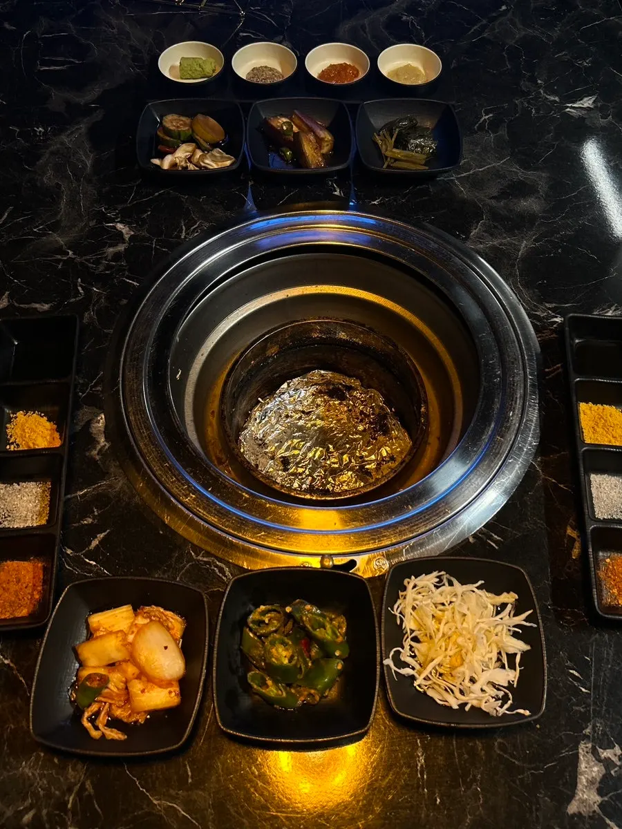 Room table setting with the charcoal grill placed on it
