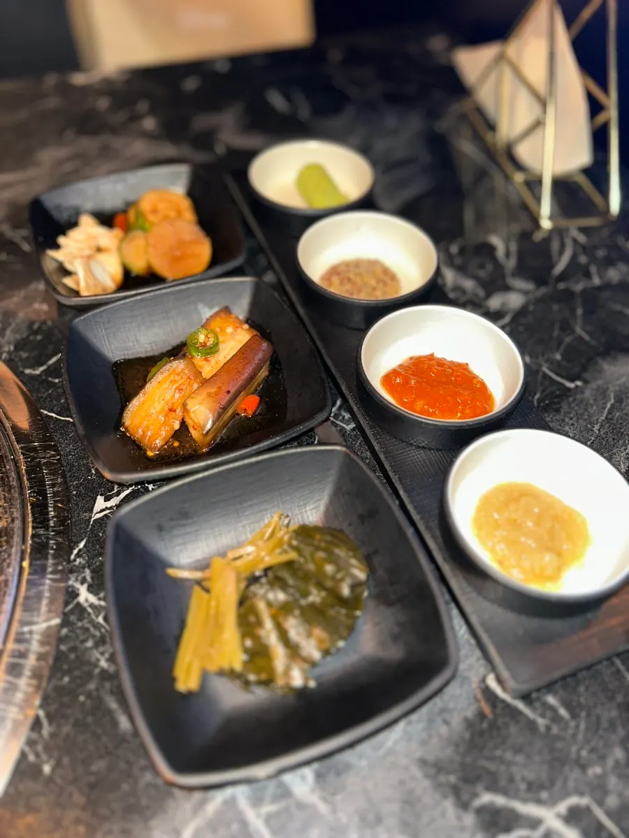 Salt, fresh wasabi, and house sauce set out