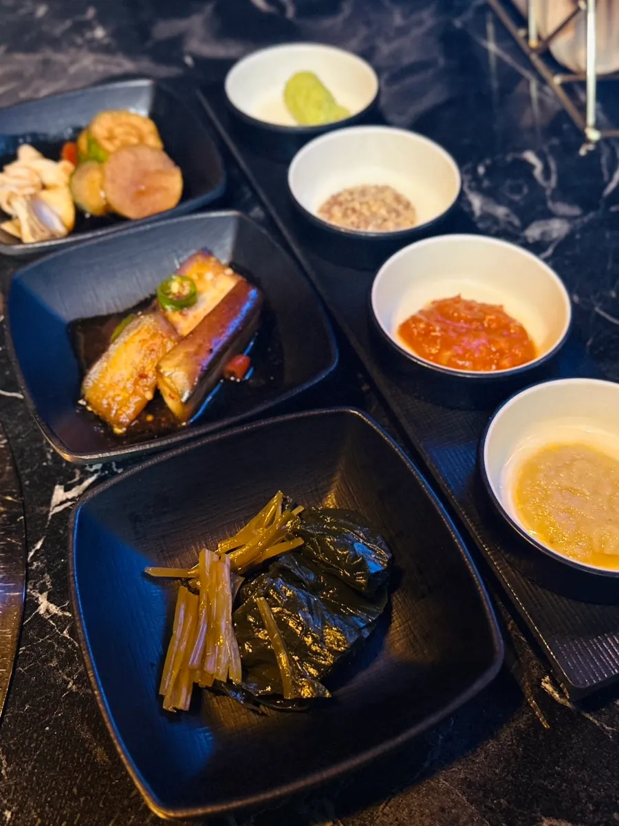 Side dishes served alongside the meat at Yuk Lab Yeouido