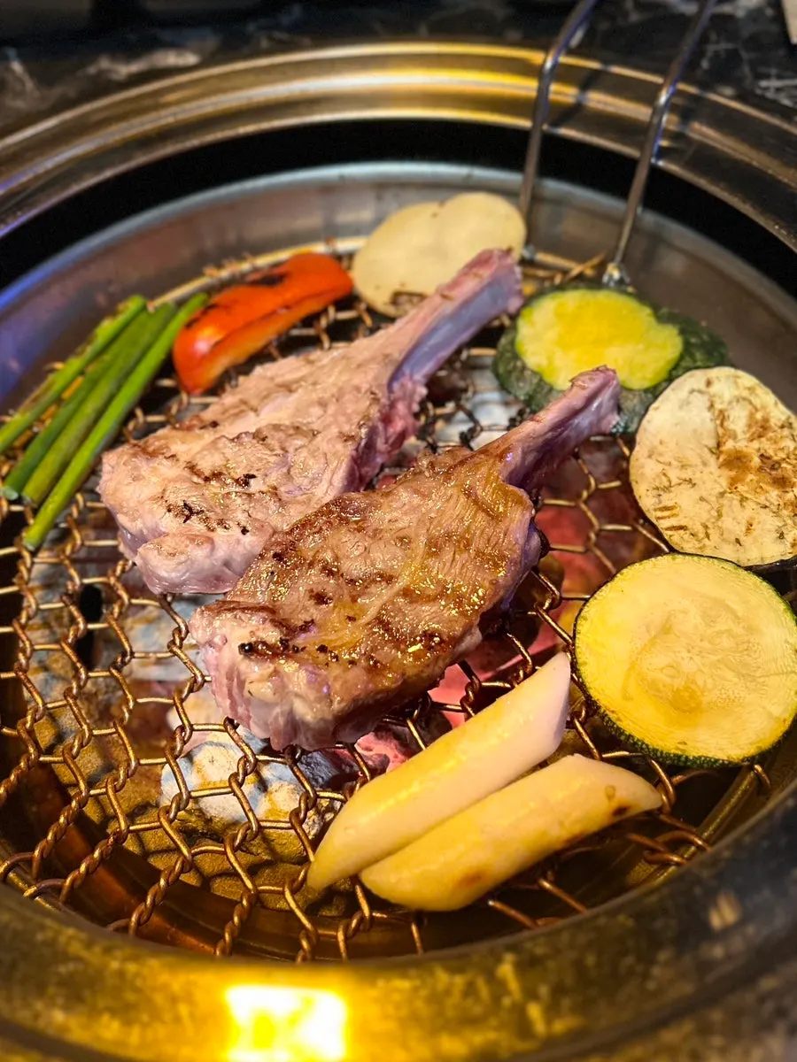 Close-up of the lamb shoulder rack grilling