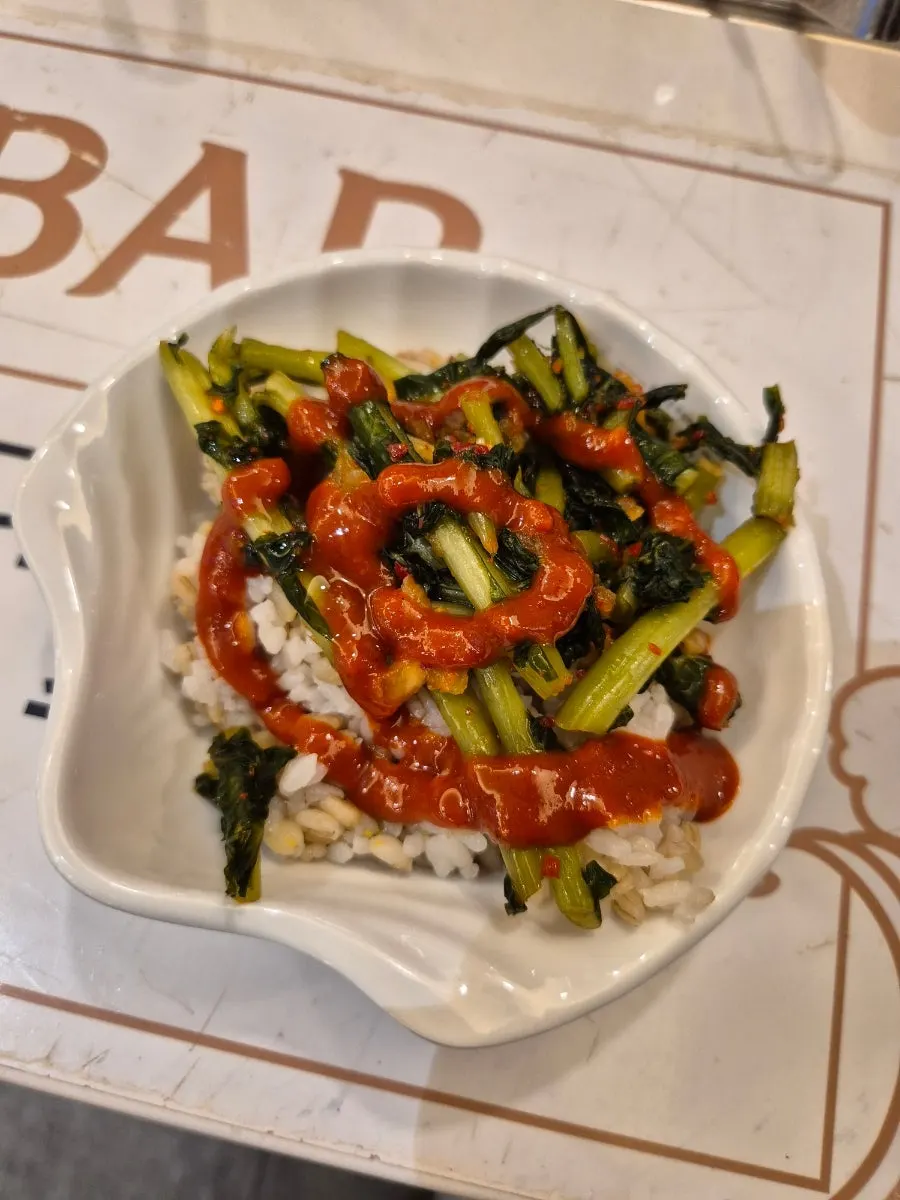 A bowl of barley rice eaten while waiting for the main dish