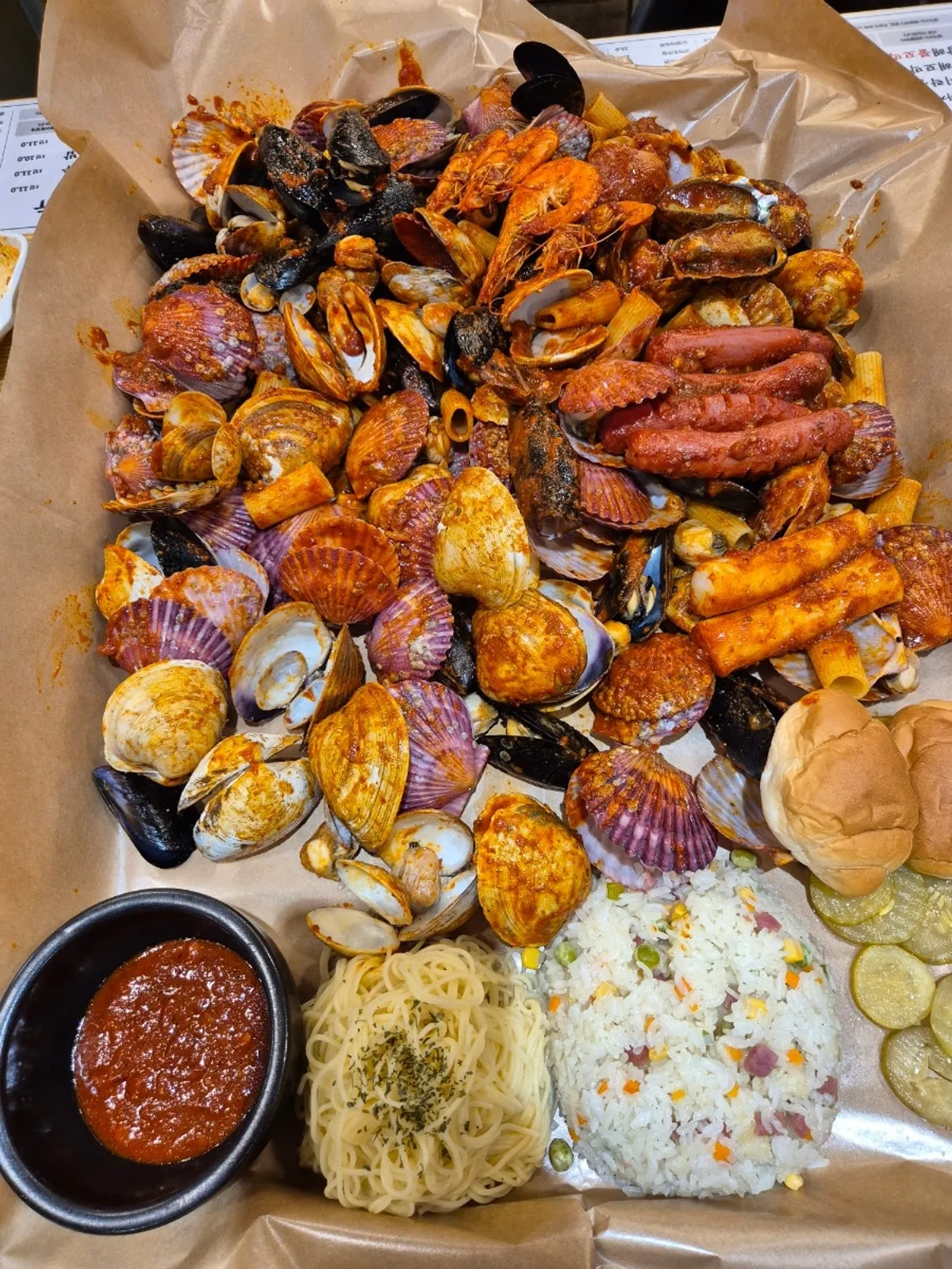 Boiling-crab-style seafood boil piled high on a tray