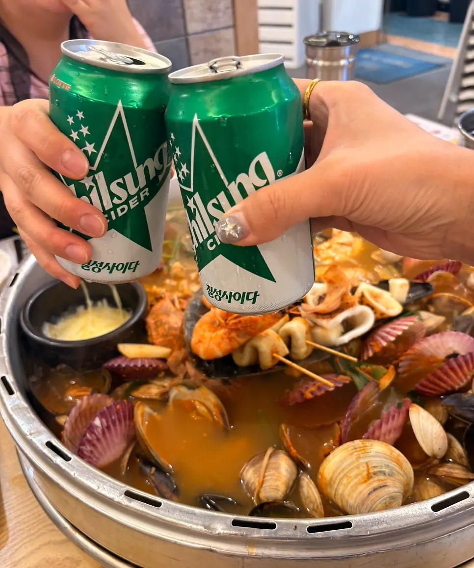 Chopsticks in hand, about to fish out clams
