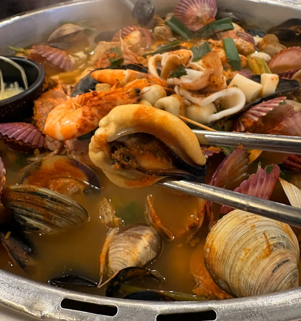 A refreshing bowl of clam hot pot broth