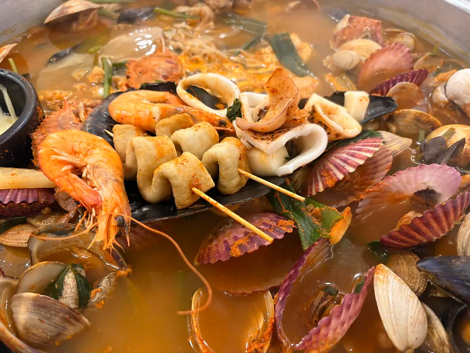 Clams and seafood scooped onto a small plate