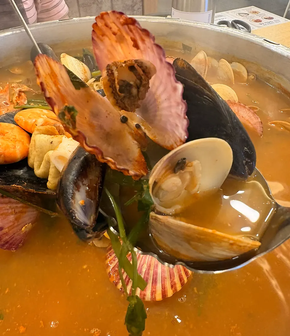 A bite of clam paired with cheese