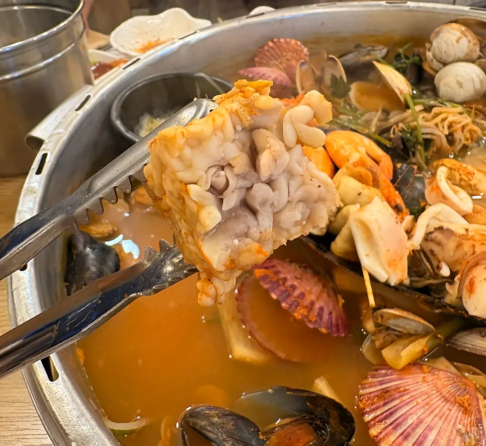 Fully cooked roe lifted out of the pot