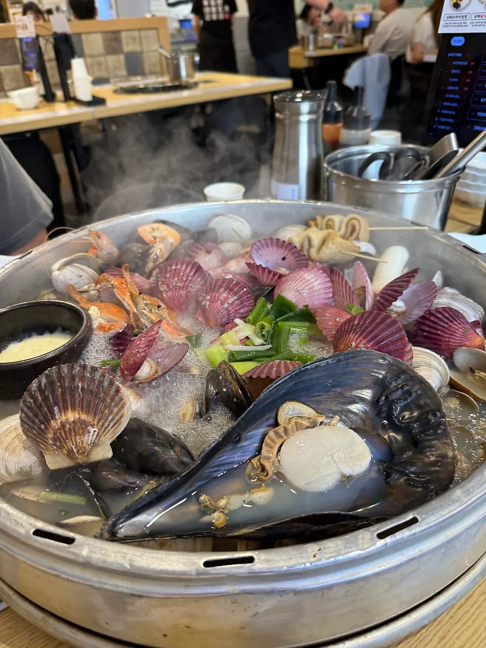 Large hot pot pot packed full of seafood