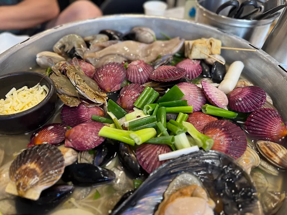 Cleaned seafood served on a half-shell clam shell