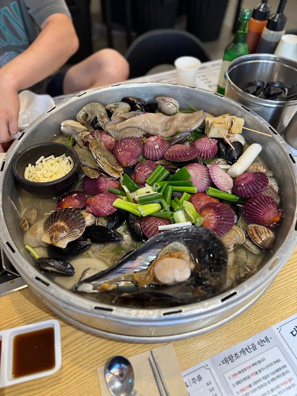 Rich hot pot broth remaining after eating the seafood