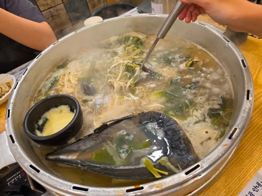 Kalguksu noodles and vegetables soaked in the broth