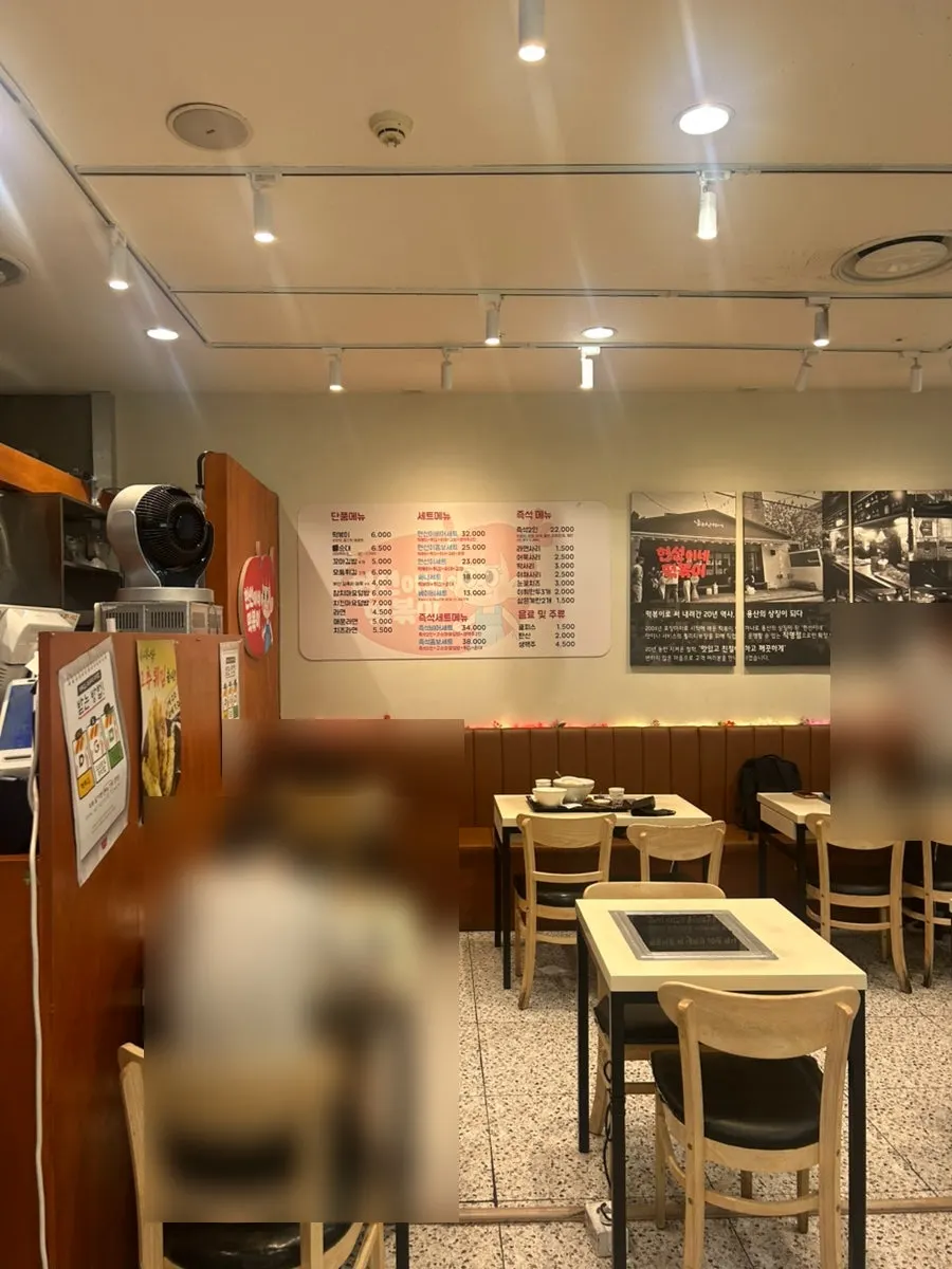 Menu board of Korean snack dishes at Hyeonseonine