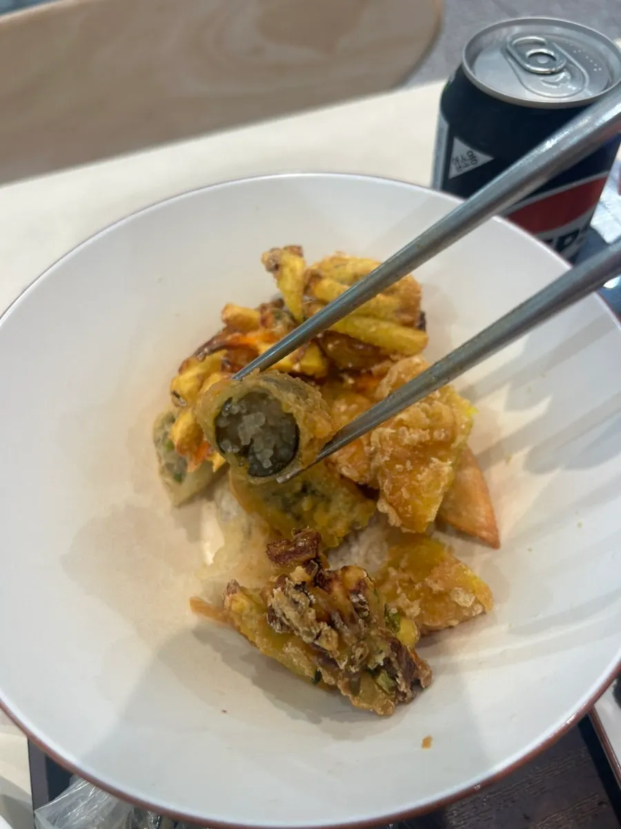 Tteokbokki served alongside broth