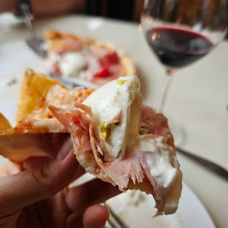 Salumi pizza topped with burrata cheese