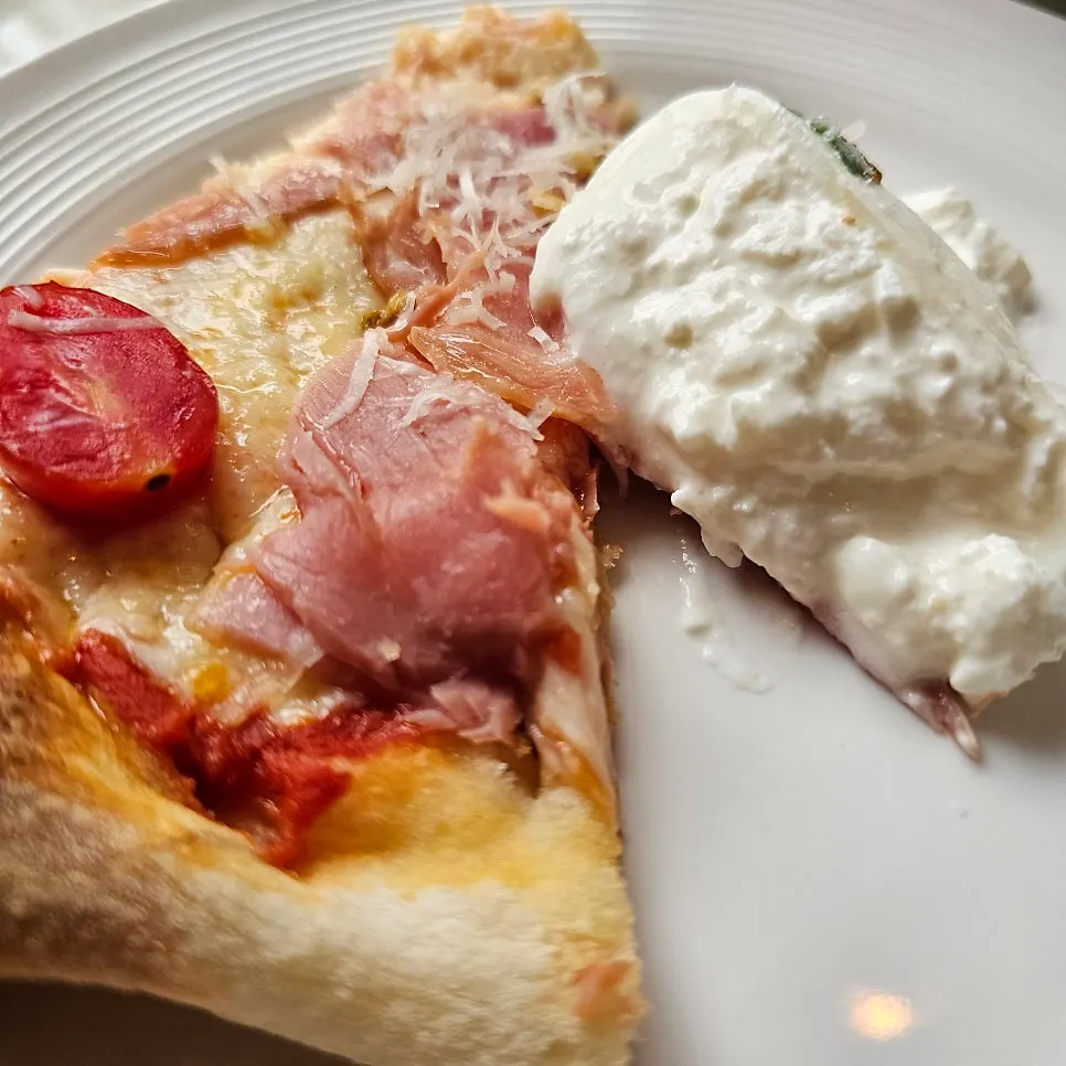 Burrata cheese cut open to show the creamy inside