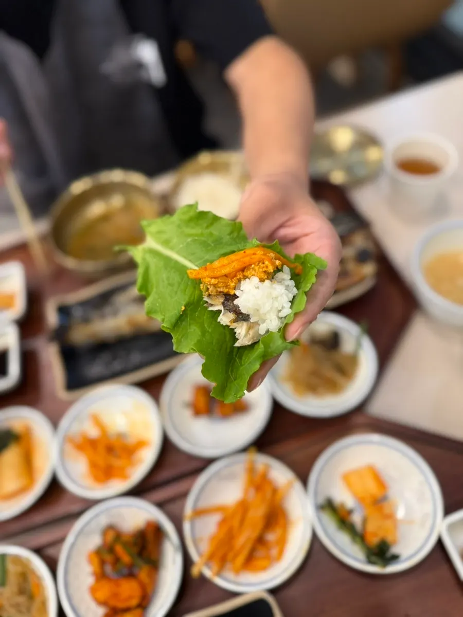 Fish flesh placed on a lettuce leaf for a wrap