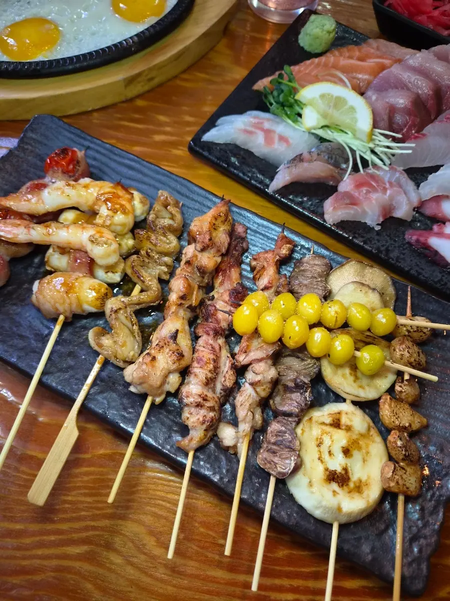 A plate of assorted skewers of various kinds