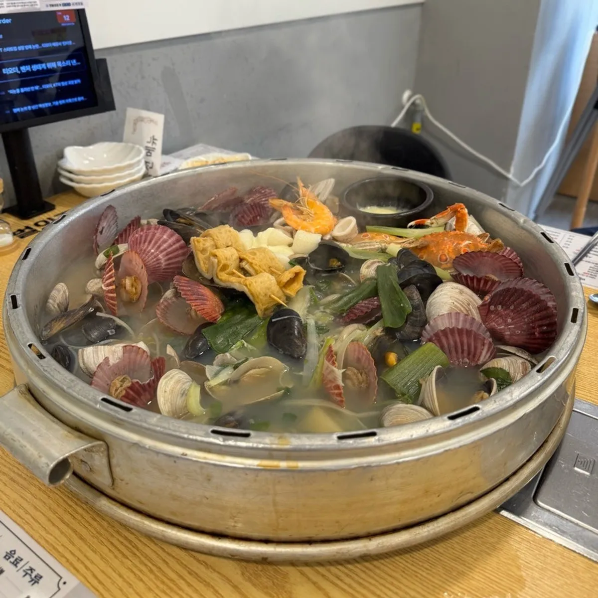 Giant clam hot pot piled high with seafood