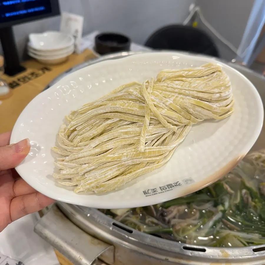 A piece of seafood dipped in cheese