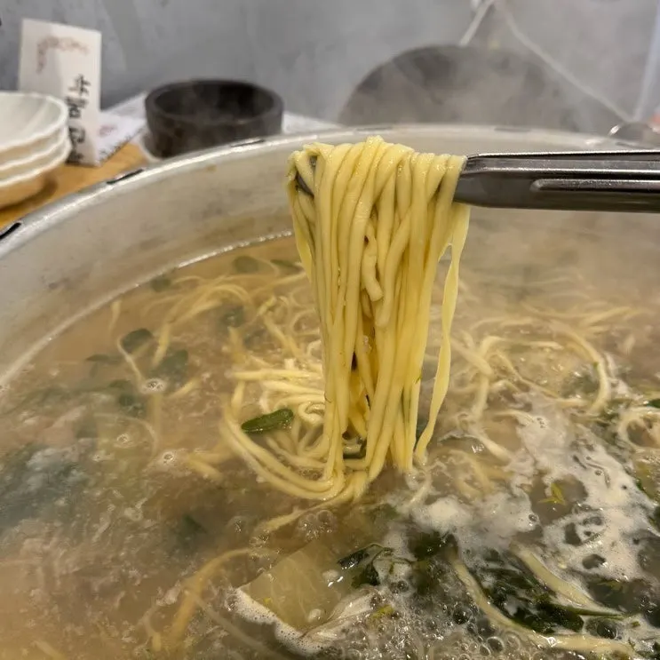 Seafood kalguksu finished with noodle sari
