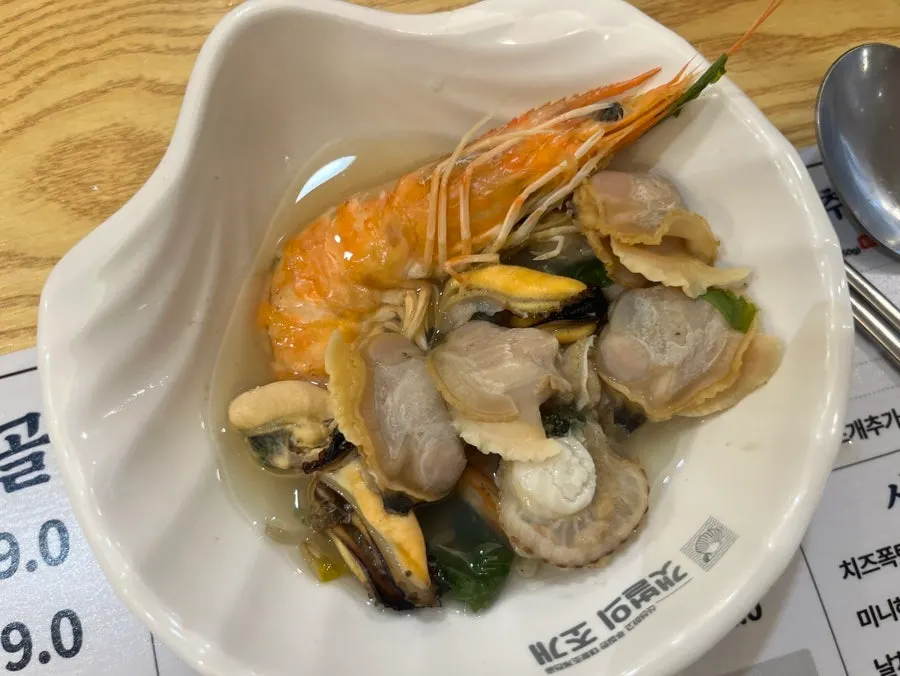 Clams and seafood soaked in the broth