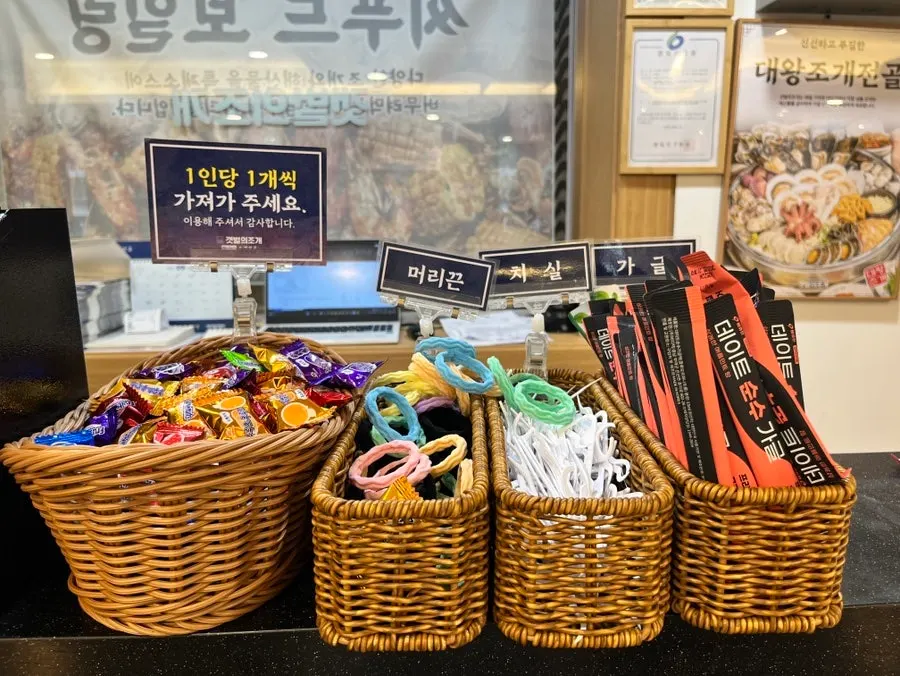 Candy, hair ties and floss set out at the counter