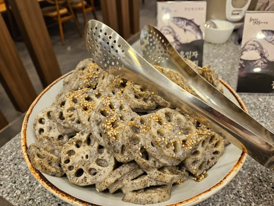 Black sesame lotus root salad on a plate