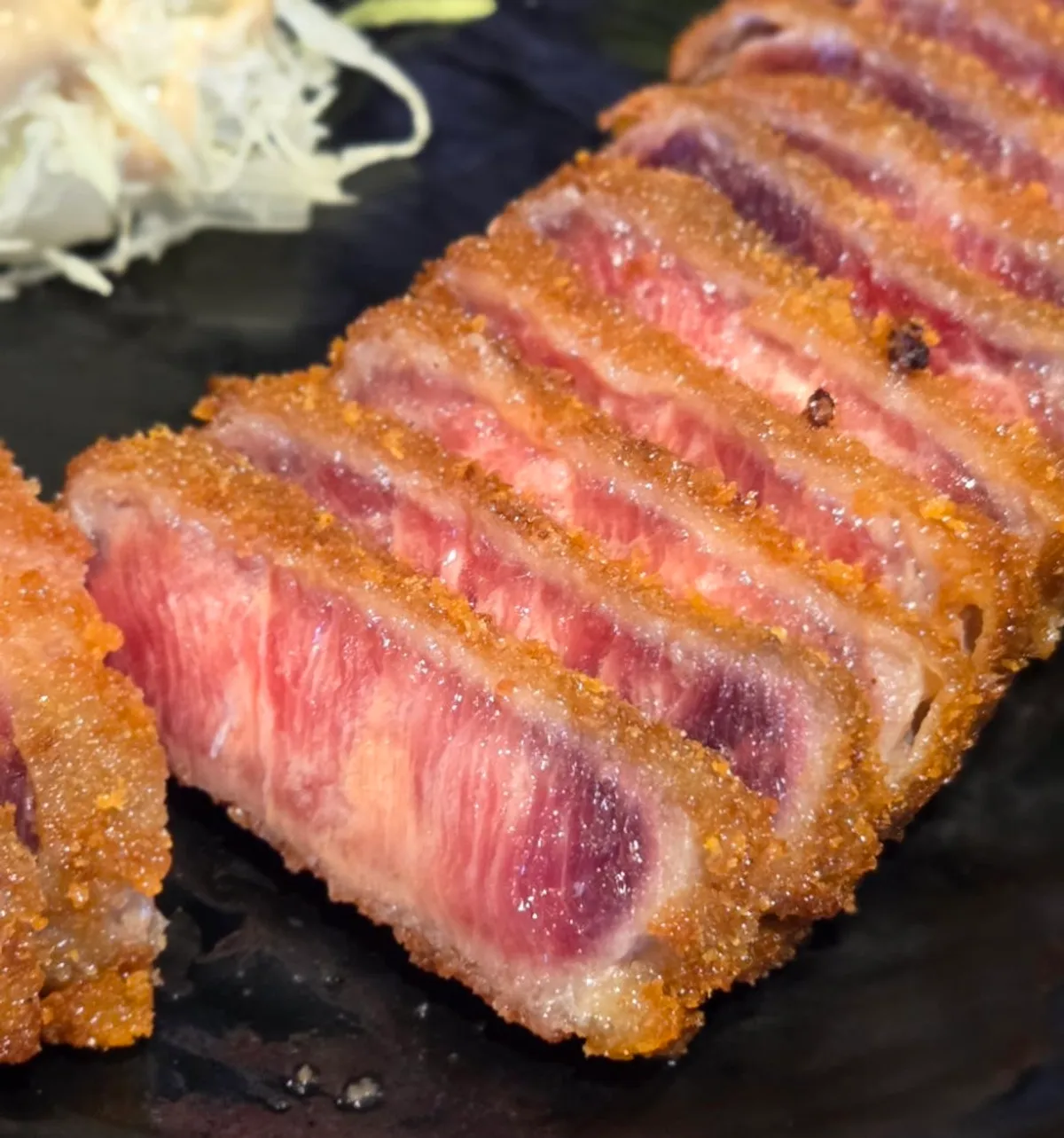 Gyukatsu set meal started with cabbage salad
