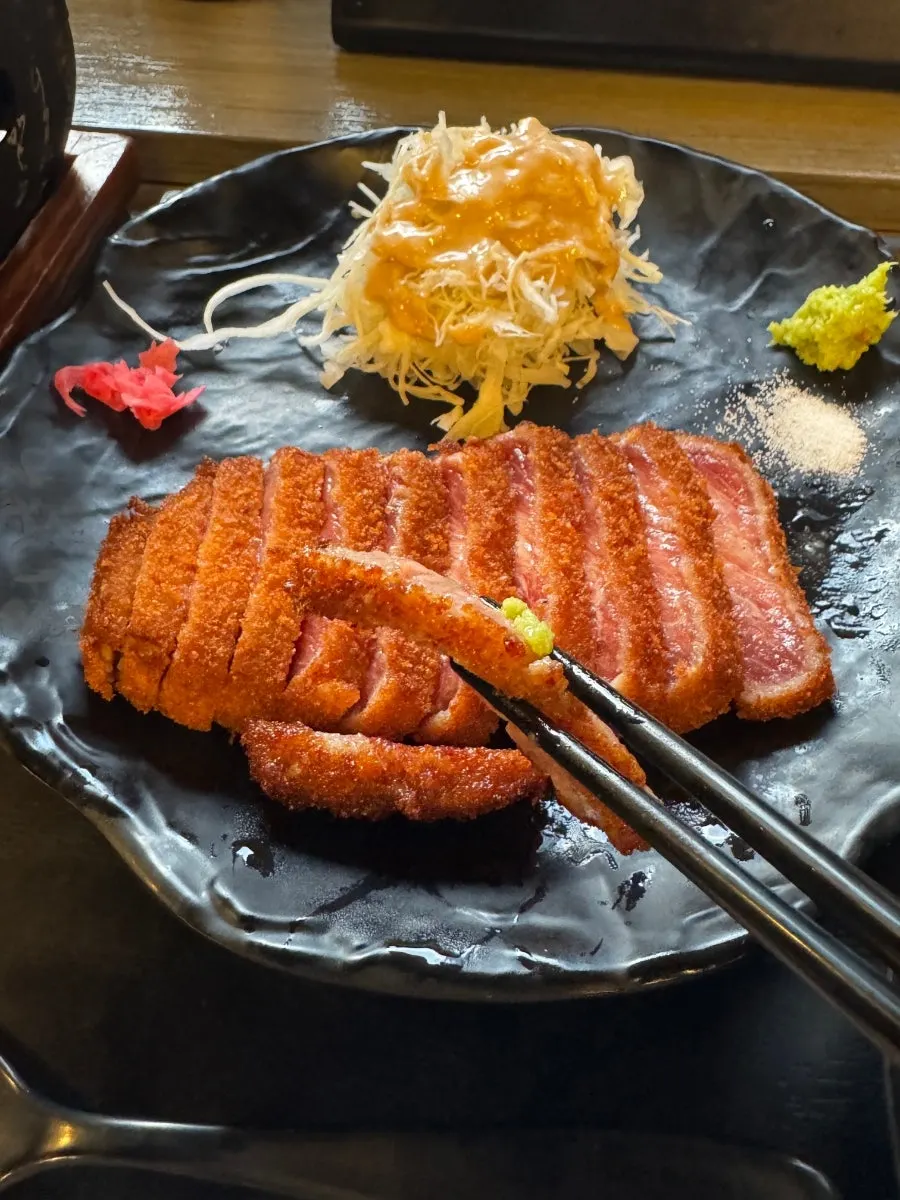 Two sauces plus diced radish kimchi and other accompaniments, four in total