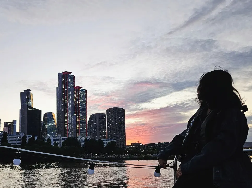 The sun setting over the Han River and Seoul skyline