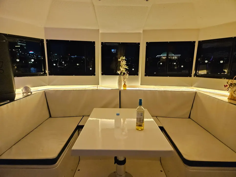 Night view of the Han River lit up, seen from the yacht deck