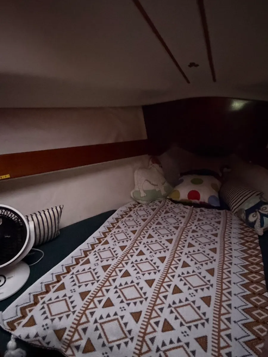 Table and bed in the below-deck relaxation space