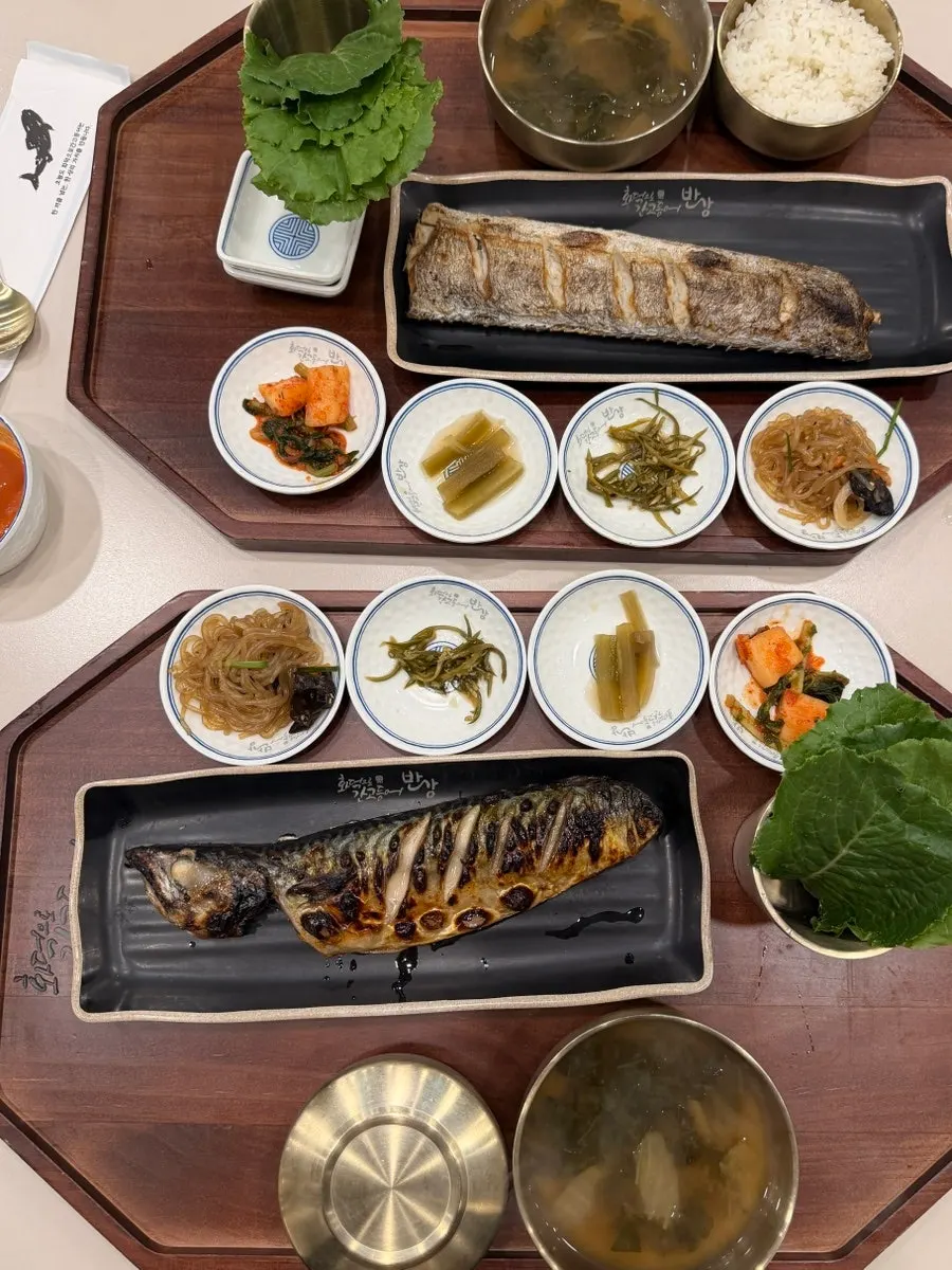 Individual grilled fish set served as a full table spread