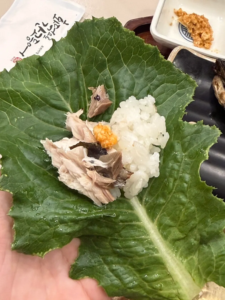 Grilled fish wrapped in a lettuce leaf