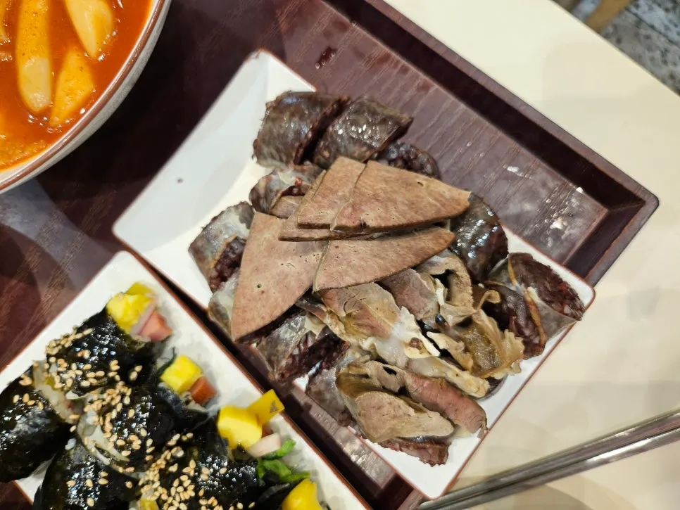 Tteokbokki and gimbap set together on the table