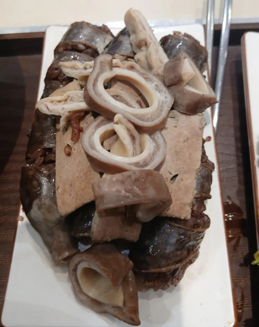 Mini gimbap served alongside tteokbokki