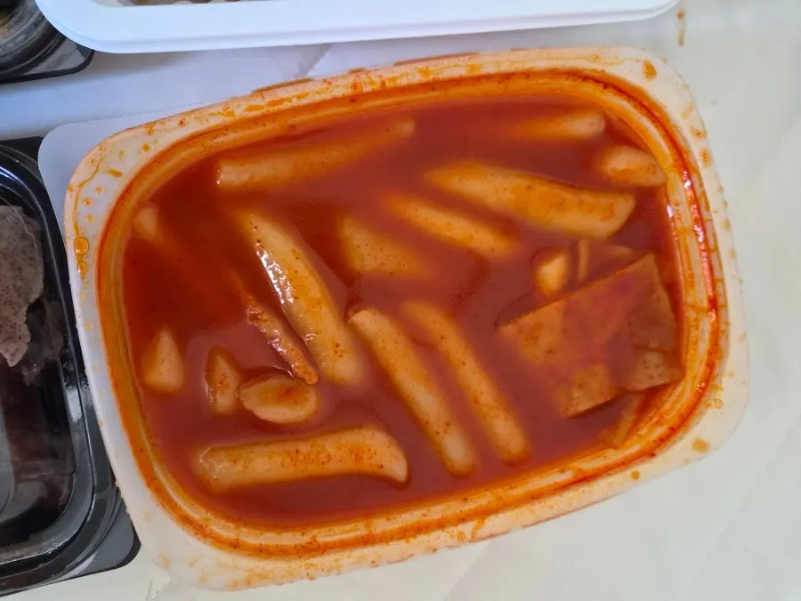 Tteokbokki, fried snacks, sundae, gimbap, and Pepsi Zero laid out