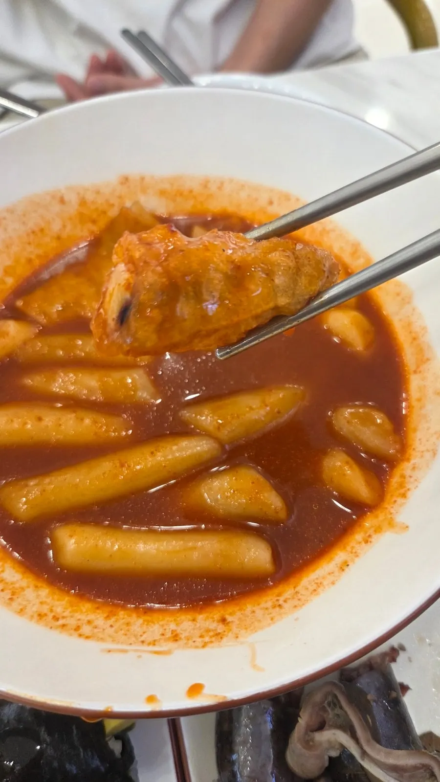Fried snacks dipped into fish cake broth