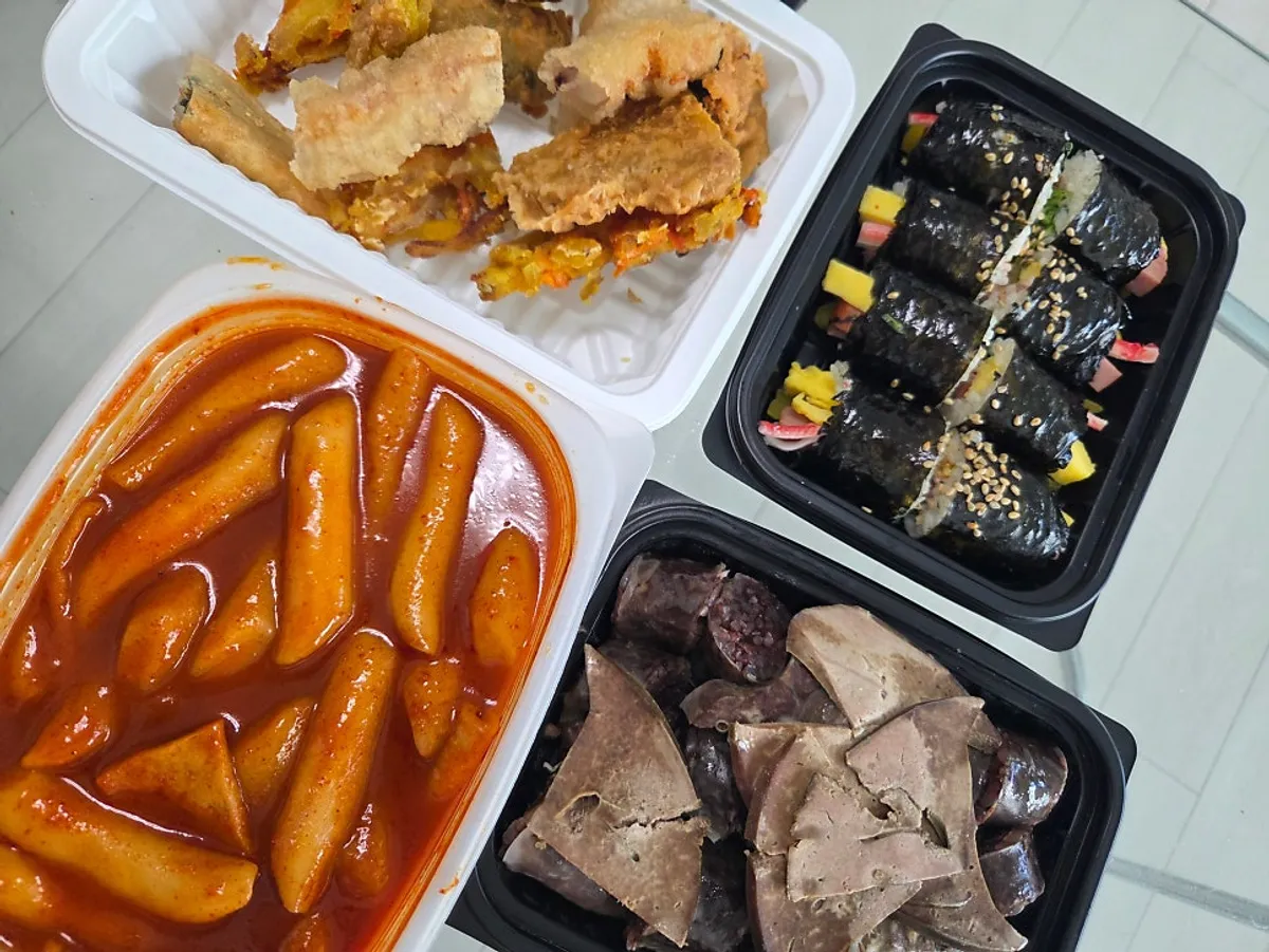 Takeout containers of the Hyeonseon Combo Set opened at home