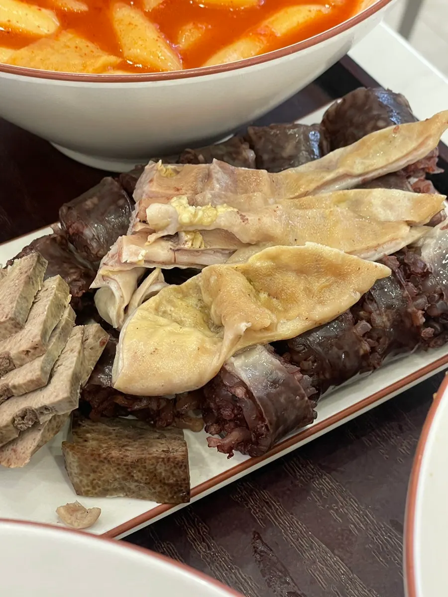 Assorted fried snacks including kimmari and vegetable fritters