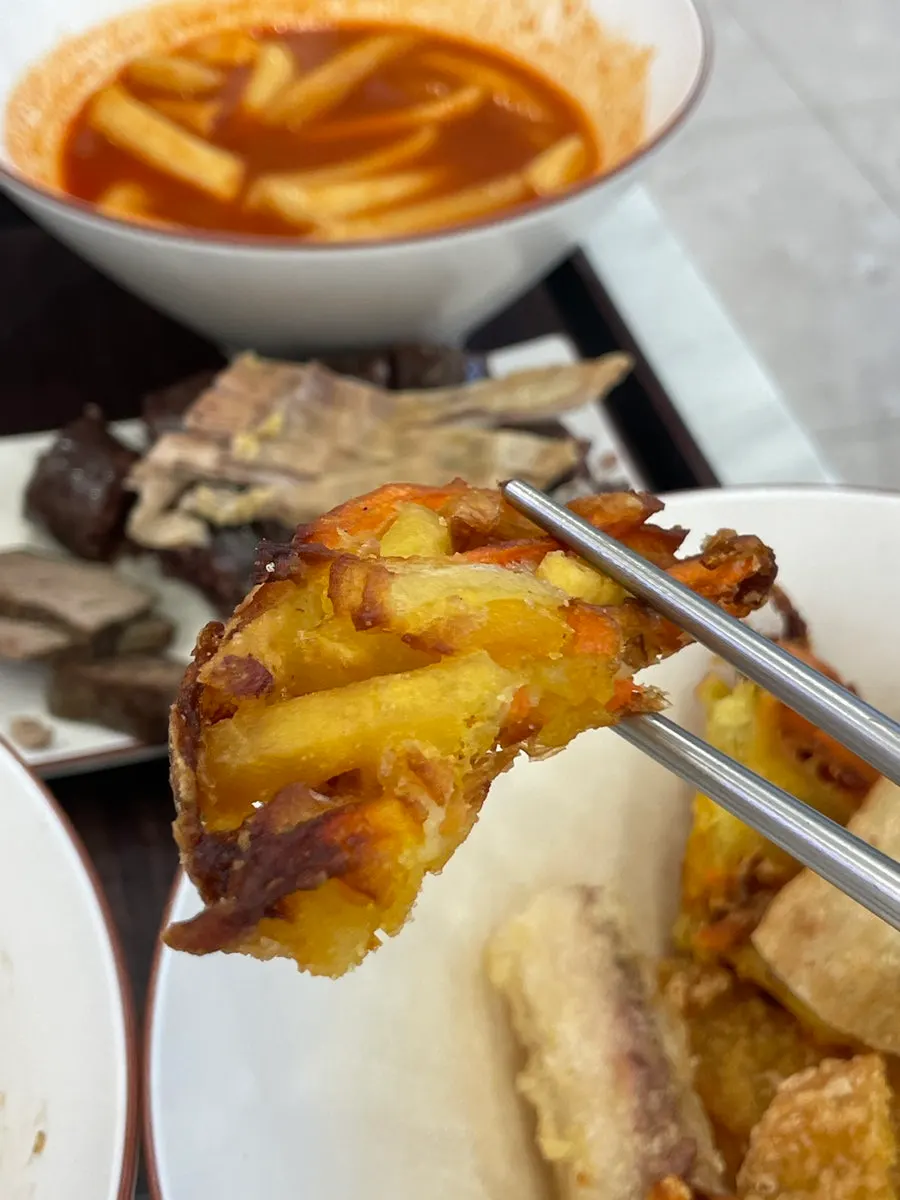 A full spread of bunsik on an outdoor table