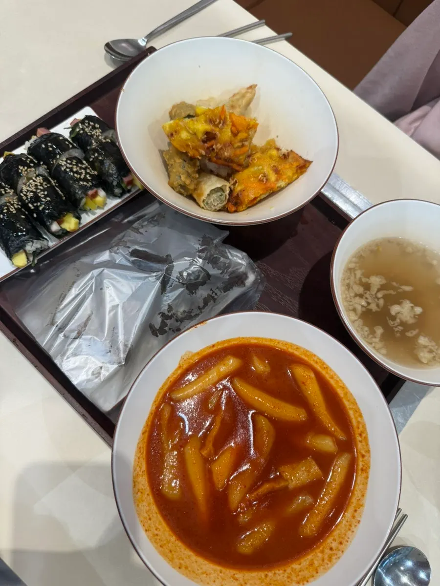 Hyeonseoni Set spread with tteokbokki, sundae, fried snacks and mini gimbap