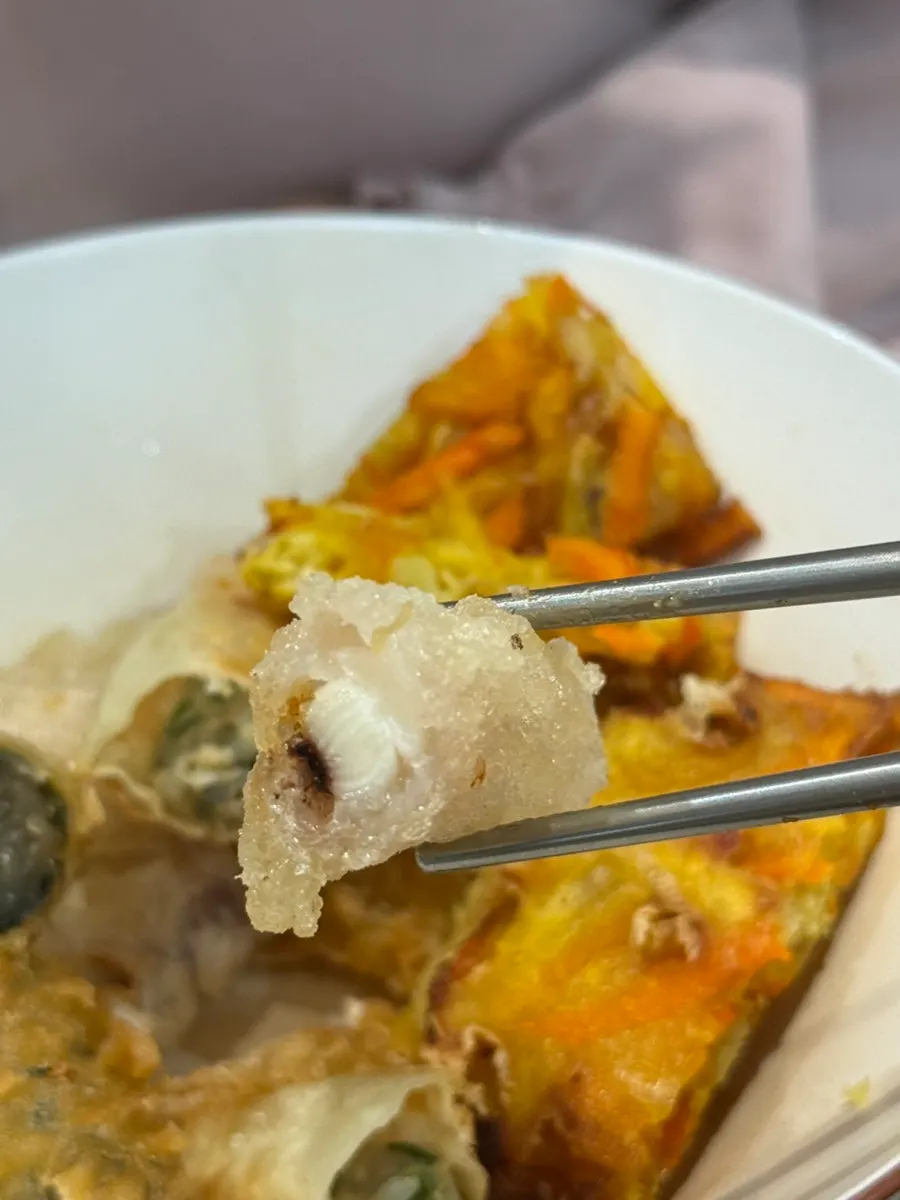Close-up of fried squid, gimmari, sweet potato and other fried snacks