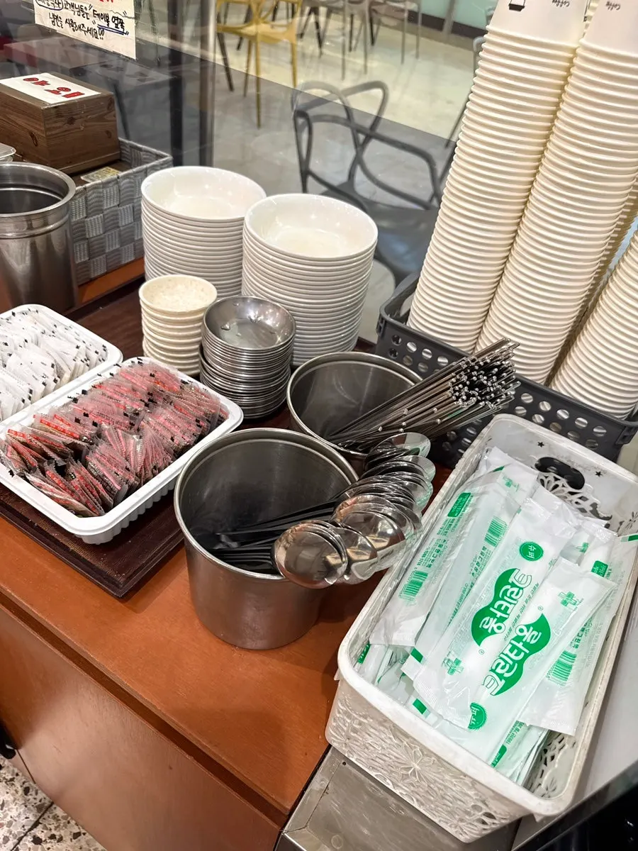 Danmuji and sauces set out at the self-serve bar